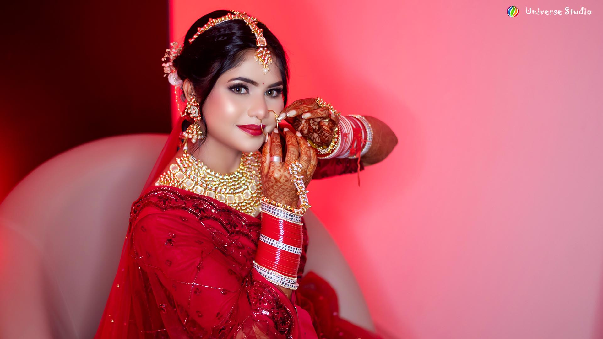 Beautiful Indian bride in red lehenga posing for a bridal photoshoot in Mirzapur